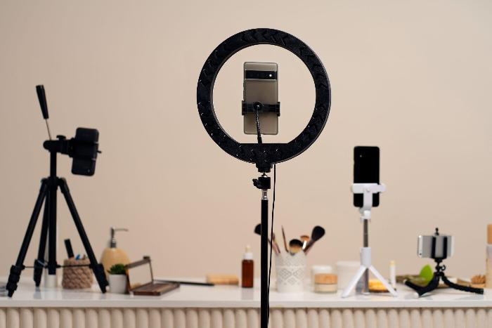 A ring light with a smartphone mounted in the center