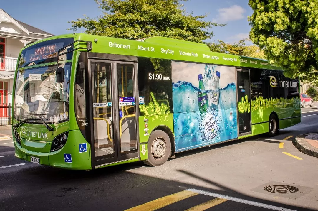 A media advertisement on a transit bus promoting products